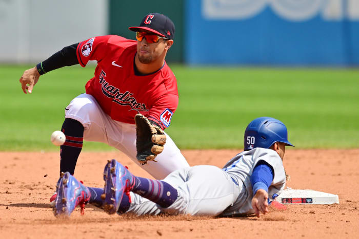 Aug 24, 2023; Cleveland, OH, USA; Cleveland Guardians second baseman Tyler Freeman (2) waist for the ball to tag out Los Angeles Dodgers right fielder Mookie Betts (50) at second base during the fourth inning at Progressive Field. Mandatory Credit: Ken Blaze-USA TODAY Sports